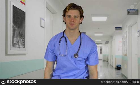 Cheerful professional male doctor in hospital