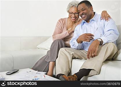 Cheerful Senior Couple On Couch