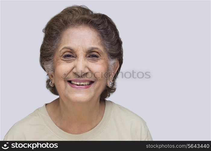 Cheerful senior woman over white background