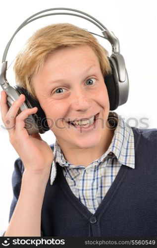 Cheerful teenage boy listening to music through headphones white background