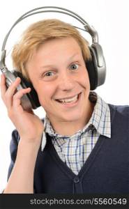 Cheerful teenage boy listening to music through headphones white background