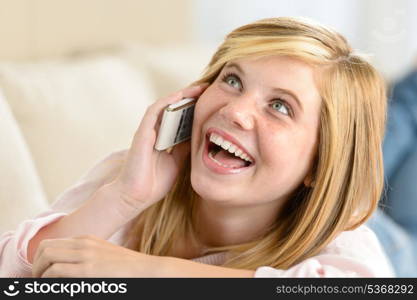 Cheerful teenage woman laughing calling on her cellphone