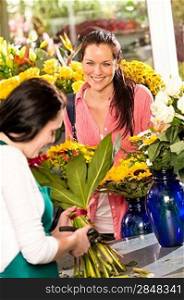Cheerful woman buying bouquet flower shop florist cutting market