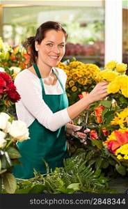 Cheerful woman flower shop market choosing working colorful market