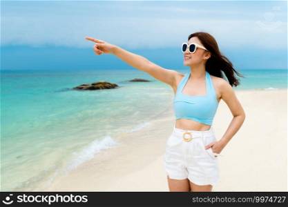 cheerful woman on the sea beach at Koh MunNork Island, Rayong, Thailand