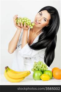 cheerful woman with green grape