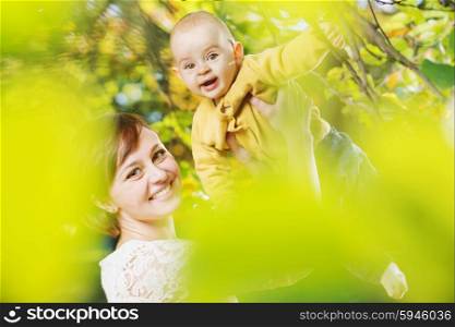 Cheerful woman with her little child