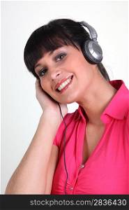 Cheerful woman with listening to music