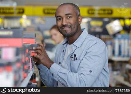 cheerful worker in hardware store