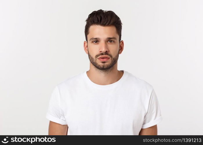 Cheerful young bearded business man show hand up excited with clenched fists. Full length portrait business man isolated over white studio background.. Cheerful young bearded business man show hand up excited with clenched fists. Full length portrait business man isolated over white studio background
