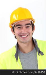 Cheerful young construction worker