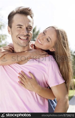 Cheerful young couple enjoying quality time in park