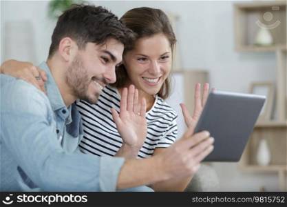 cheerful young couple having a video call