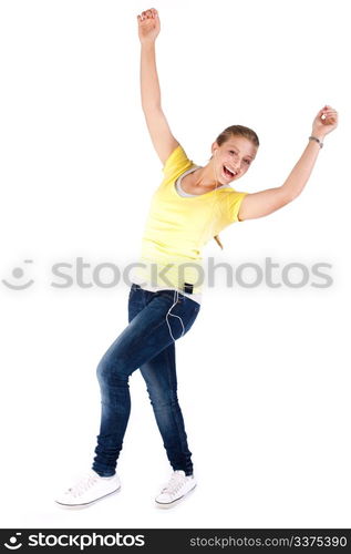 Cheerful young girl enjoying music and dancing isolated on white background.