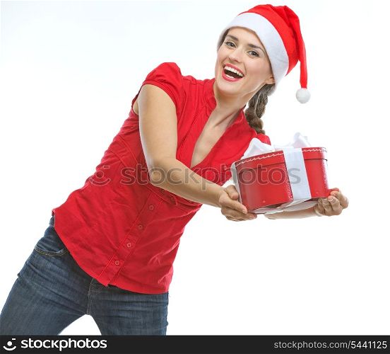 Cheerful young woman presenting Christmas gift box