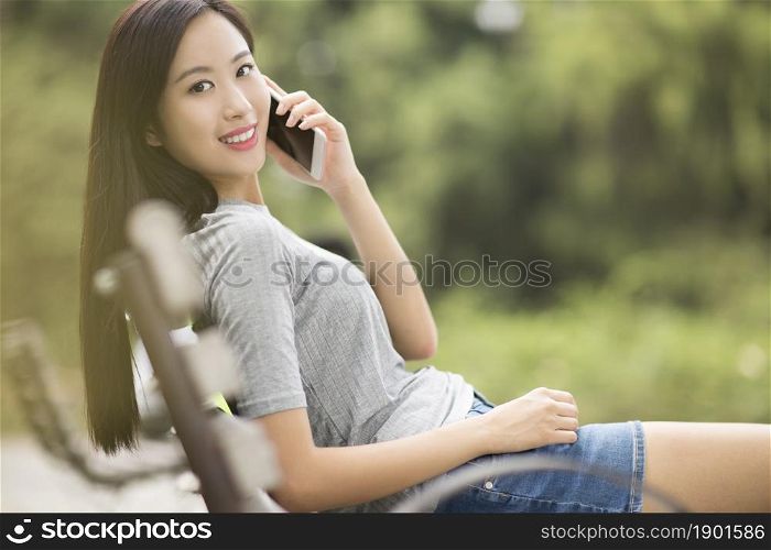 Cheerful young woman talking on the phone