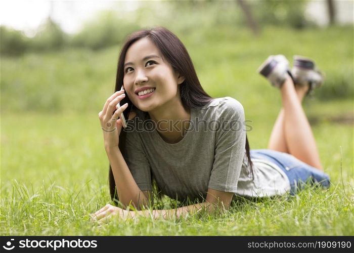 Cheerful young woman talking on the phone