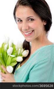 Cheerful young woman with bouquet of white tulips