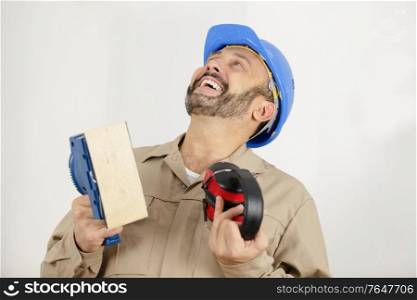 cheering construction worker talking to someone
