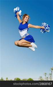 Cheerleader Performing Cheer in Mid-Air