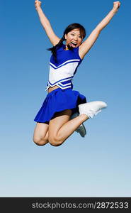 Cheerleader Performing Cheer in Mid-Air