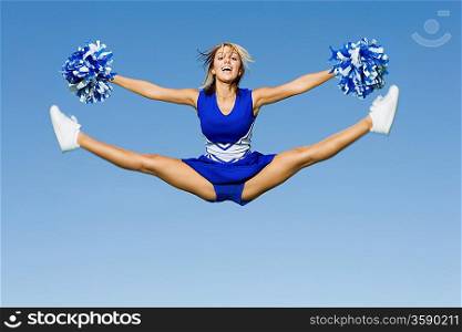 Cheerleader Performing Cheer in Mid-Air