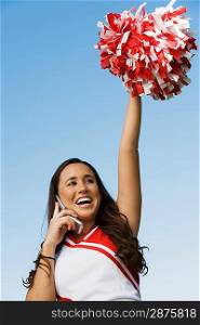 Cheerleader Using Cell Phone