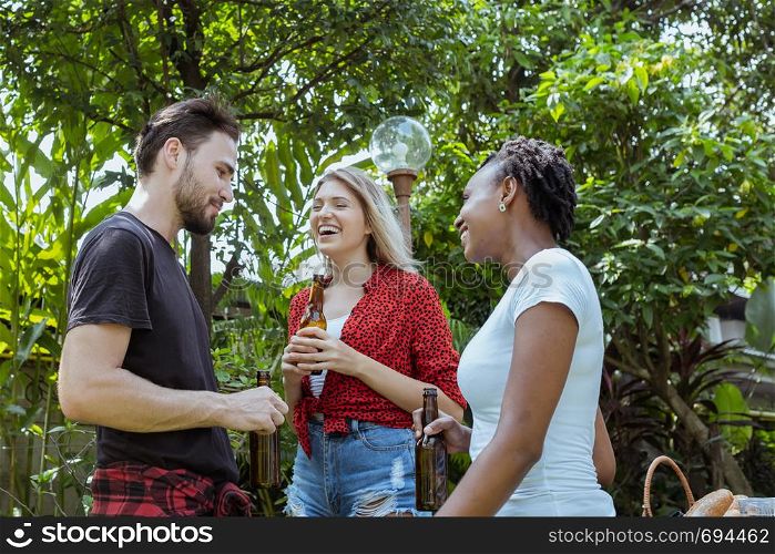 Cheers, Group of people cheering with beer for drinking and discuss about dinner party in nature outdoor as summer lifestyle