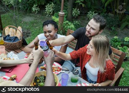 Cheers, Group of people cheering with beer for drinking in nature outdoor as summer lifestyle