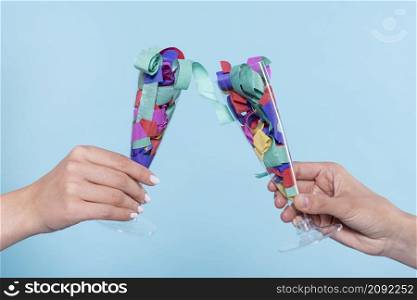 cheers with glasses with confetti