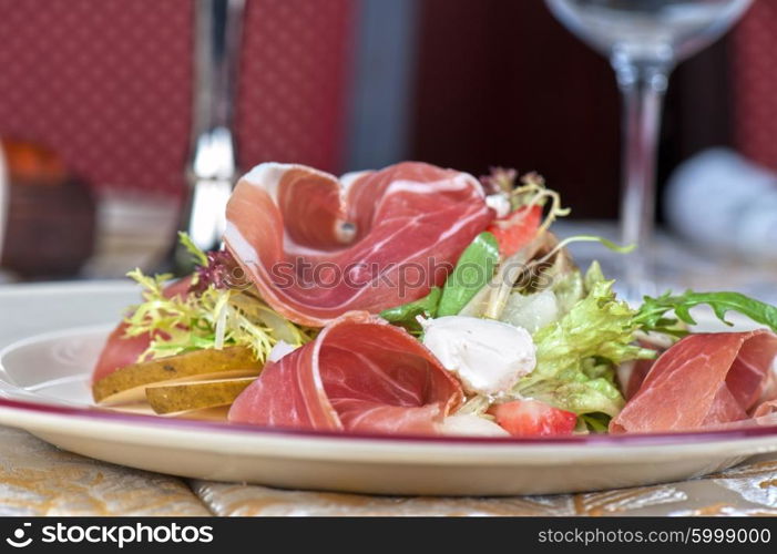 cheese and bacon salad. Green salad with cheese and bacon