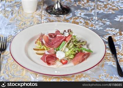 cheese and bacon salad. Green salad with cheese and bacon