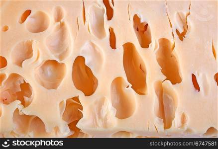Cheese background with holes