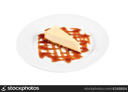 Cheese Cake with honey sauce closeup on white plate