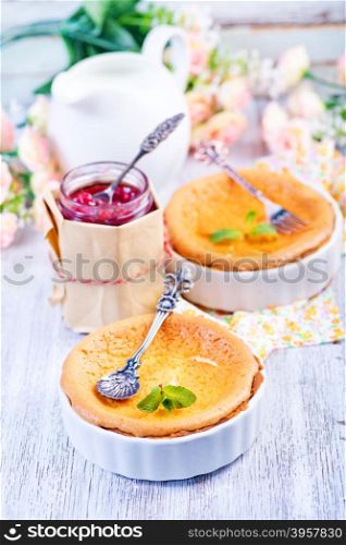 cheese cake with jam on a table