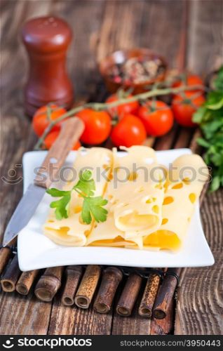 cheese on plate and on a table