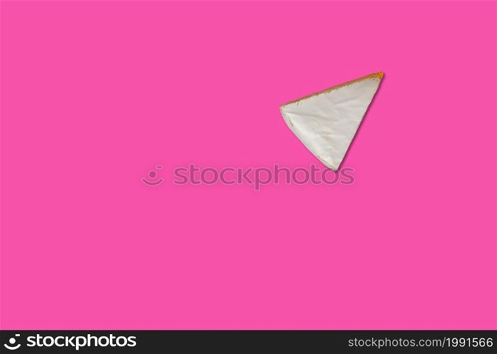 Cheese piece in Creative conceptual top view flat lay composition with copy space isolated on pink background in minimal style