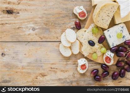cheese platters with grapes bread wooden desk