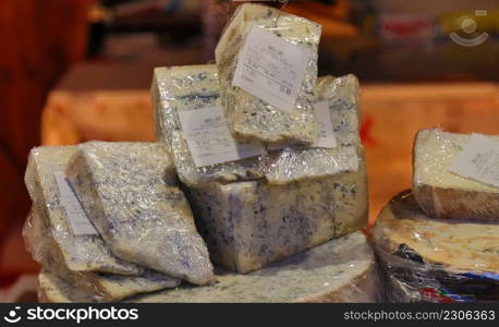 cheese shapes and pieces displayed for sale