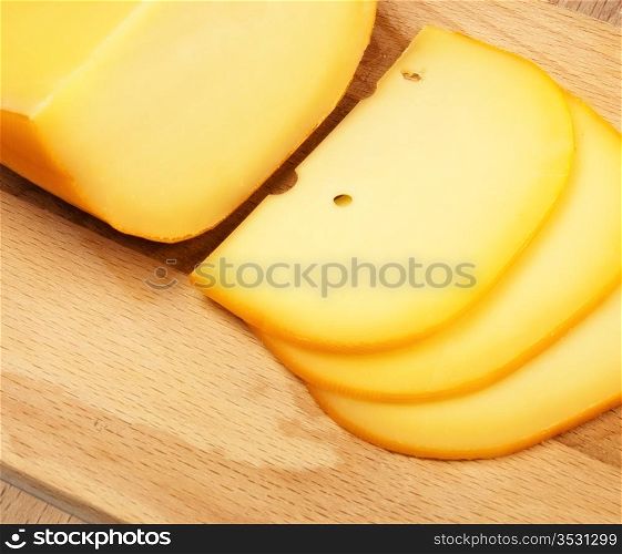 cheese slices on cutting board, top view