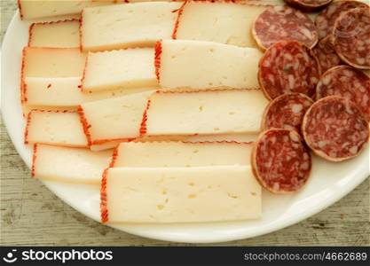 Cheese tray party and sausage. Cold appetizer