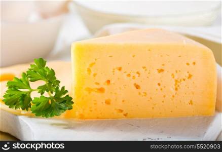 cheese with parsley on wooden table
