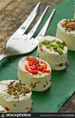 cheese with spices on wooden background