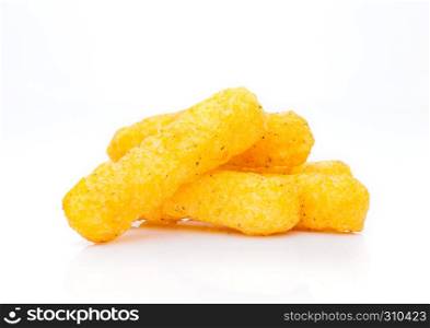 Cheese yellow corn snacks closeup on white background