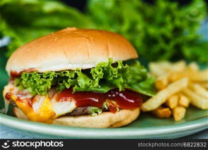 Cheeseburger, french fried and green vegetables