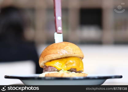 Cheeseburger on table with shallow depth of field