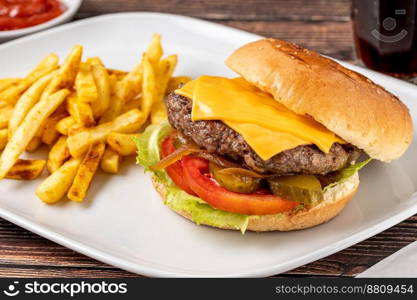 Cheeseburger with Tomatoes and Pickles with French Fries and Ketchup