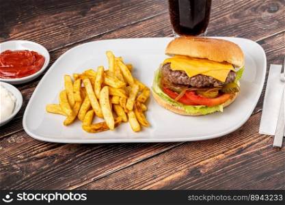 Cheeseburger with Tomatoes and Pickles with French Fries and Ketchup