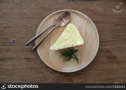 cheesecake japanese style with green tea on wood background