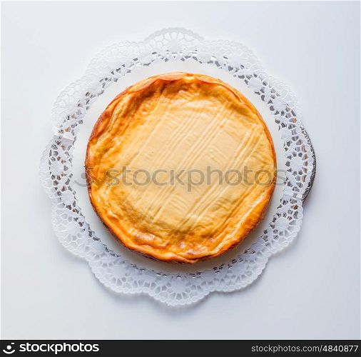 Cheesecake on a white background with cake lace. Cheesecake on a white background with cake lace.